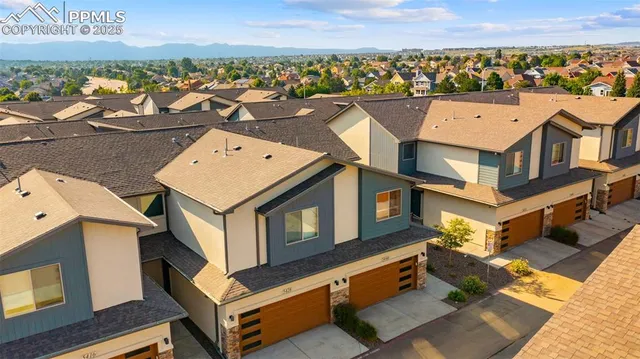 an aerial view of a house with a ocean view