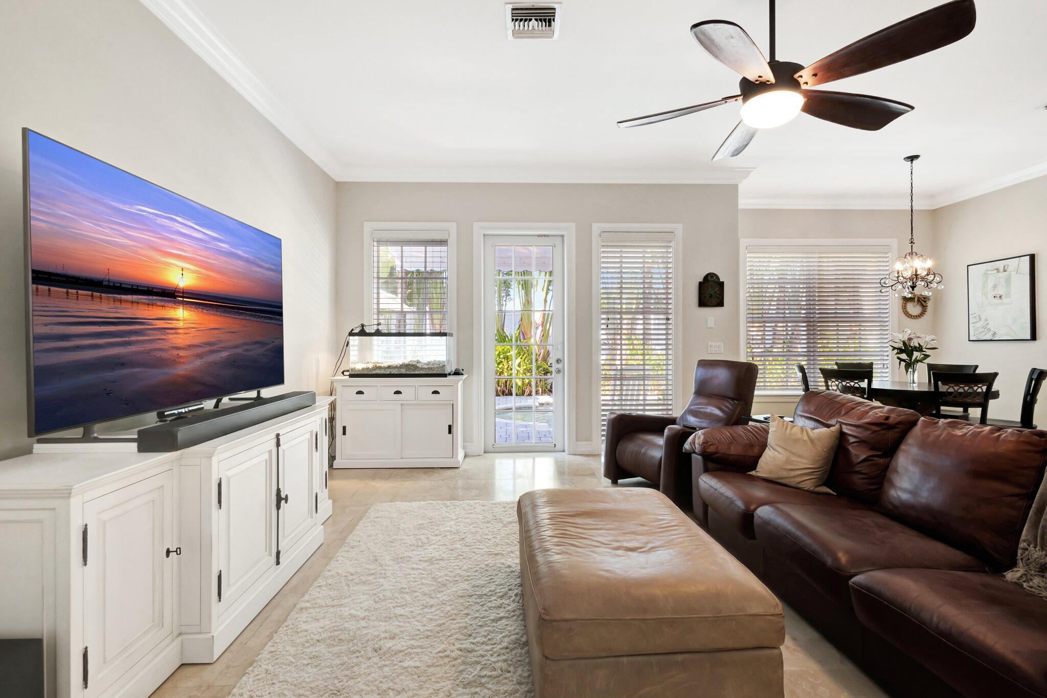 213 Kings Lynn Delray Beach, FL 33444 - Photo 15 of 39 a living room with furniture and a flat screen tv