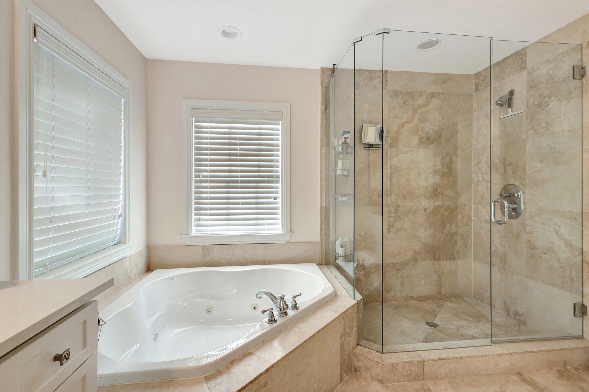 213 Kings Lynn Delray Beach, FL 33444 - Photo 20 of 39 a bathroom with a bath tub and a shower