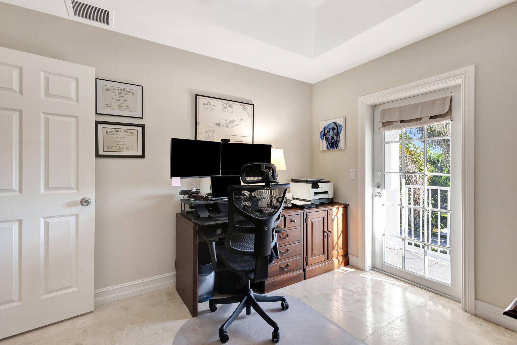 213 Kings Lynn Delray Beach, FL 33444 - Photo 26 of 39 a view of a workspace with furniture and a window