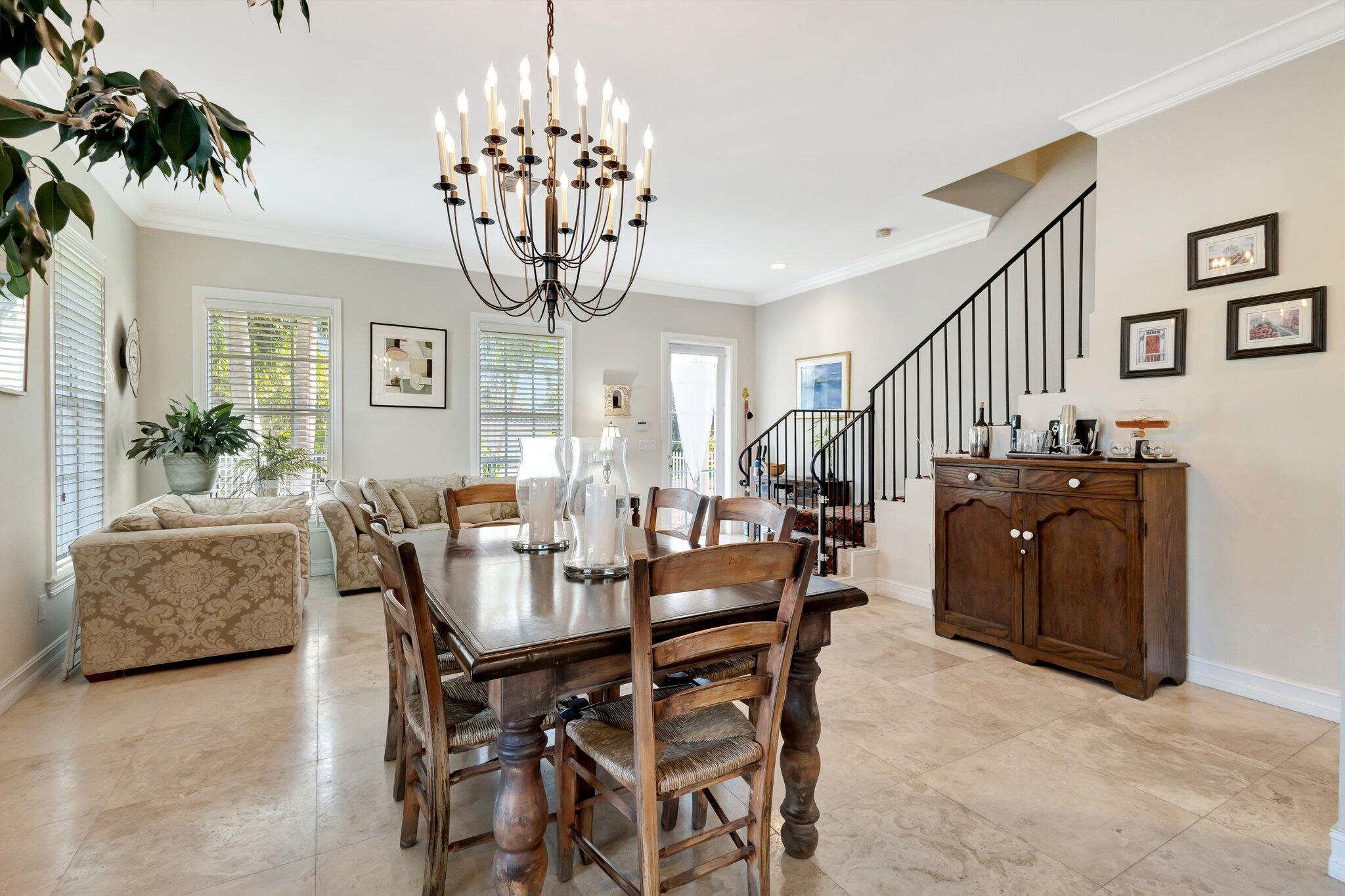 213 Kings Lynn Delray Beach, FL 33444 - Photo 5 of 39 a view of a dining room with furniture