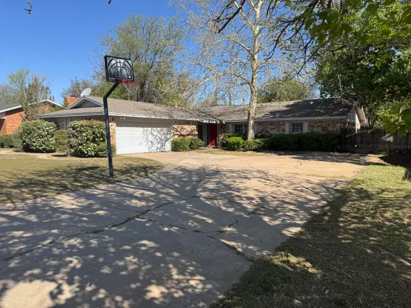 a street view with a bench in front of house