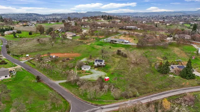 a view of a city with mountains in the background