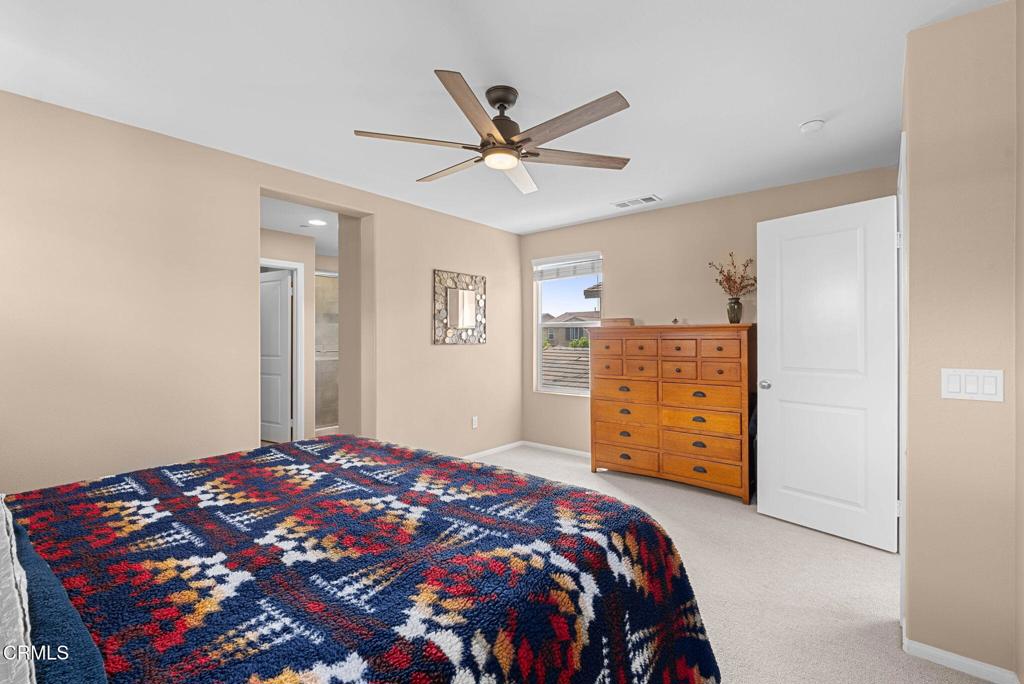 3512 North Oxnard Boulevard Oxnard, CA 93036 - Photo 13 of 41 a bedroom with a bed and a dresser