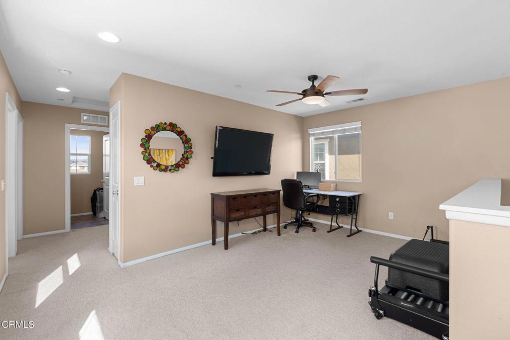 3512 North Oxnard Boulevard Oxnard, CA 93036 - Photo 14 of 41 a living room with furniture and a flat screen tv