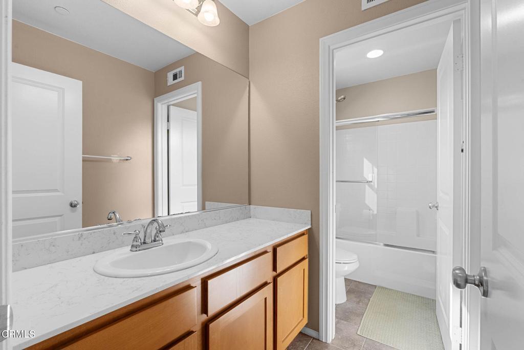 3512 North Oxnard Boulevard Oxnard, CA 93036 - Photo 18 of 41 a bathroom with a sink and a mirror
