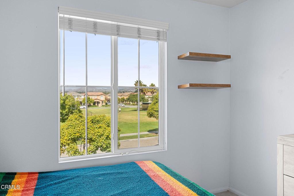 3512 North Oxnard Boulevard Oxnard, CA 93036 - Photo 21 of 41 a view of an empty room with wooden floor and a window