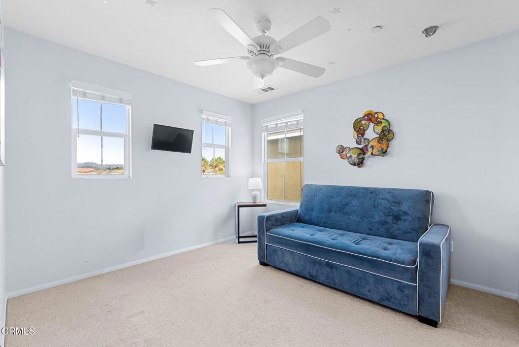 3512 North Oxnard Boulevard Oxnard, CA 93036 - Photo 23 of 41 a living room with furniture and a flat screen tv