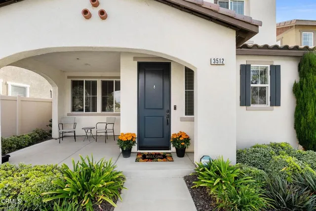 a view of a patio with table and chairs in patio