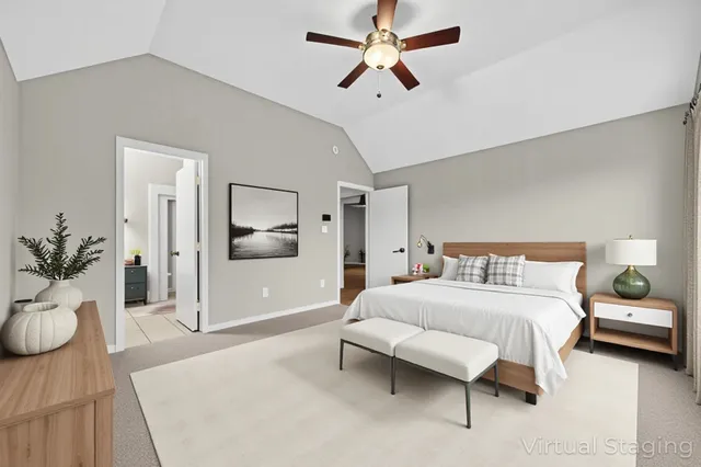 a bedroom with a bed couch and window