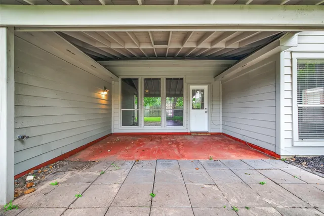 a view of backyard with a large window