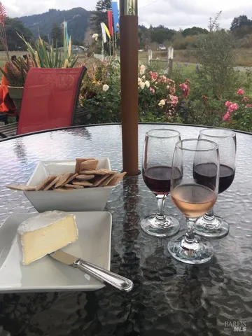 a outdoor sitting area with furniture and city view