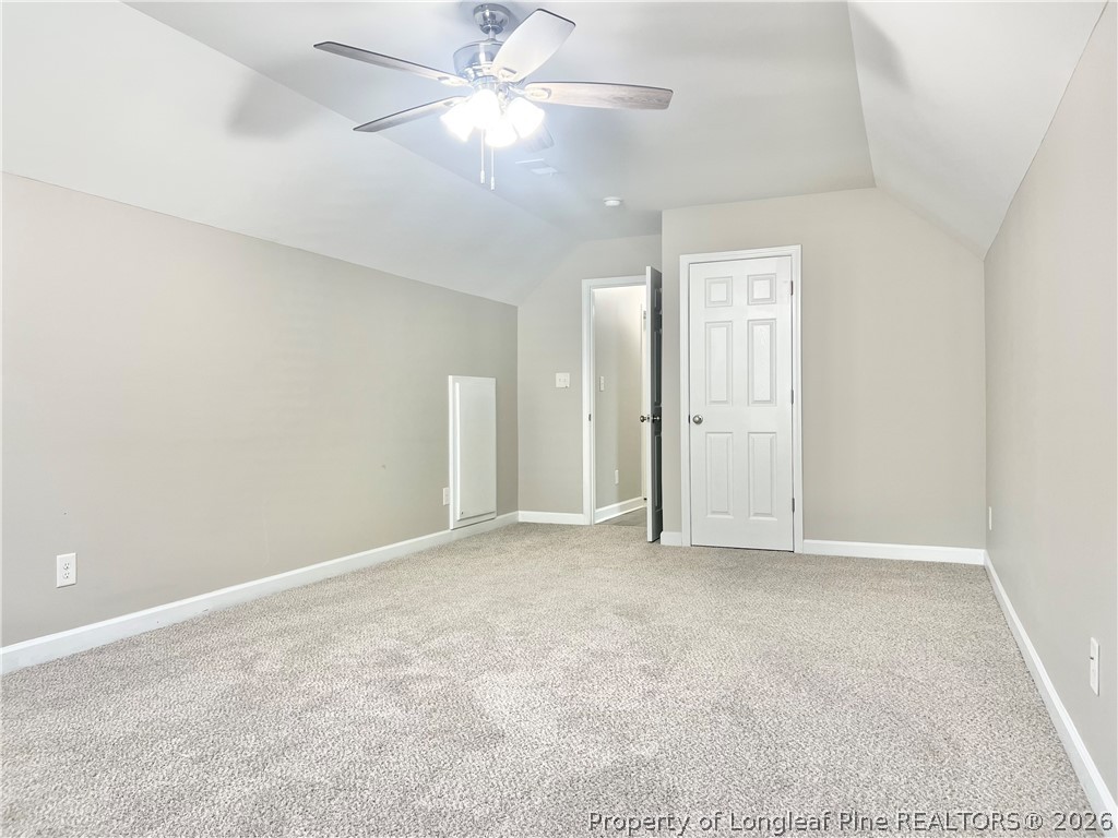 1523 Rough Rider Lane Parkton, NC 28371 - Photo 39 of 42 an empty room with fan and entrance