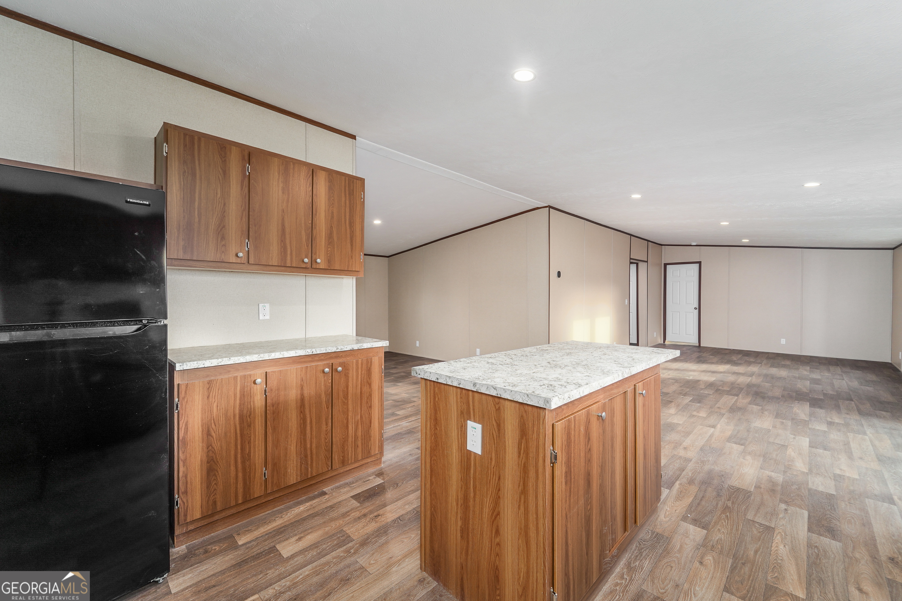 1808 Brunel Street Waycross, GA 31503 - Photo 11 of 26 a kitchen with a sink refrigerator and cabinets