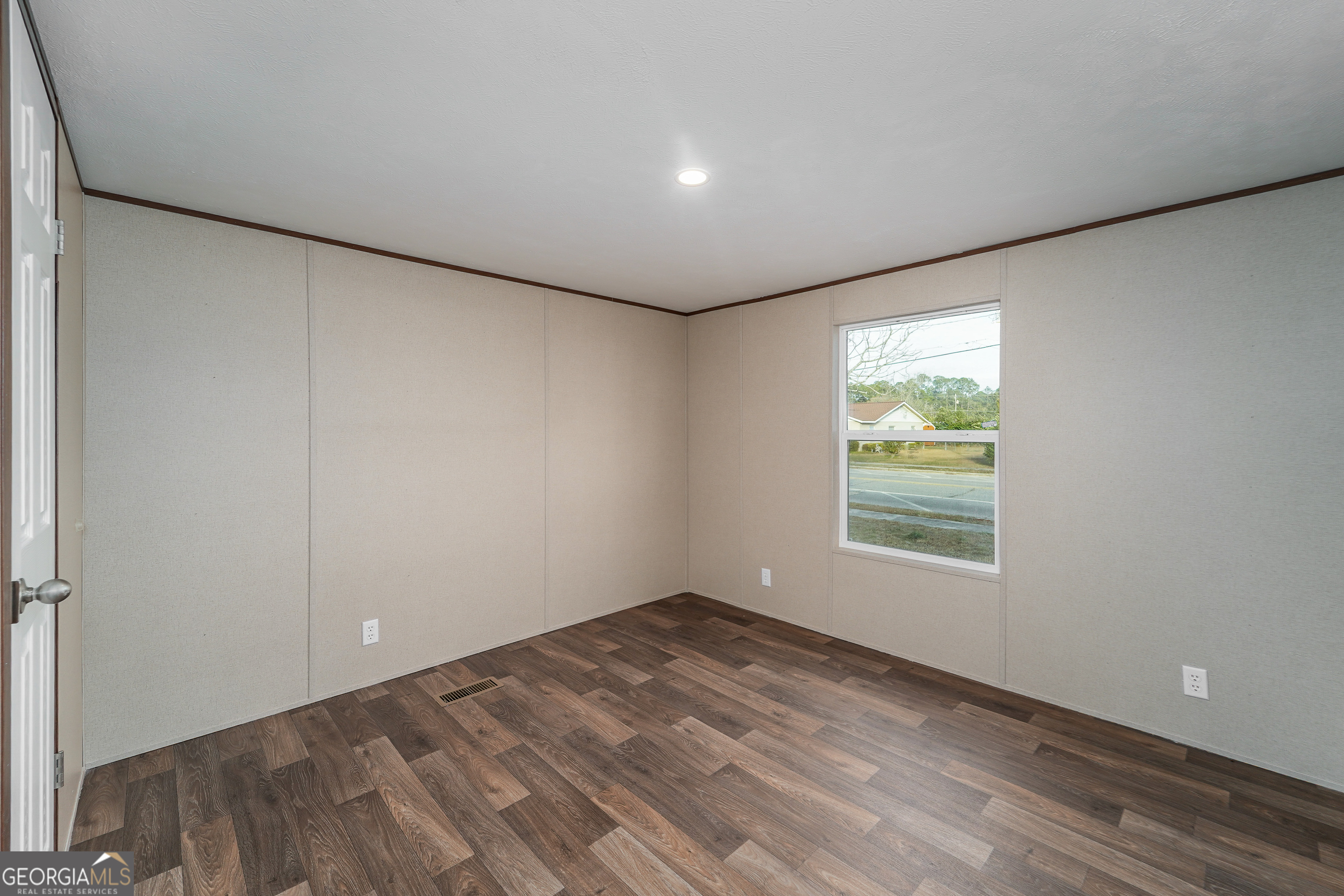 1808 Brunel Street Waycross, GA 31503 - Photo 18 of 26 a view of an empty room with a window