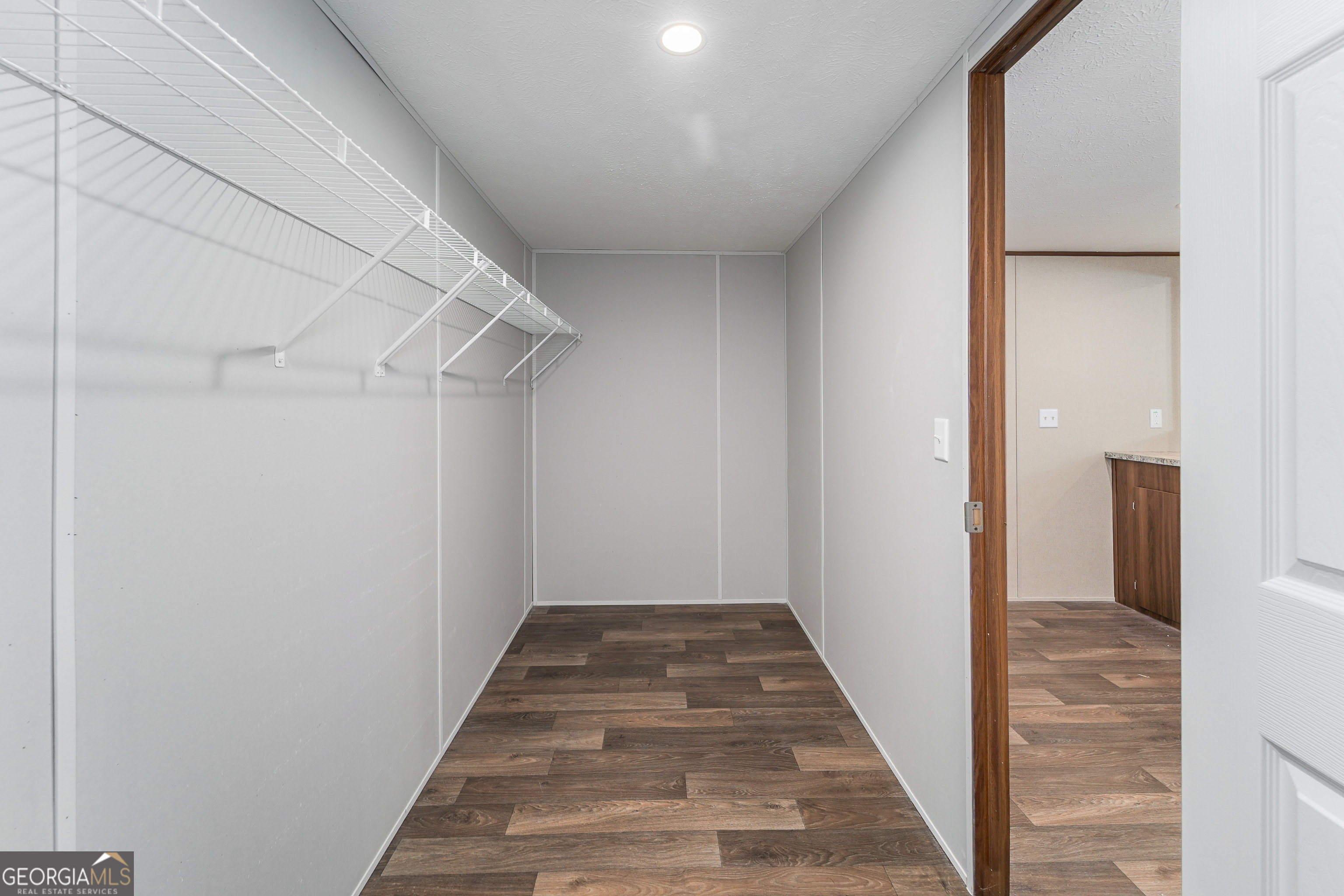 1808 Brunel Street Waycross, GA 31503 - Photo 22 of 26 a view of a hallway with wooden floor and staircase