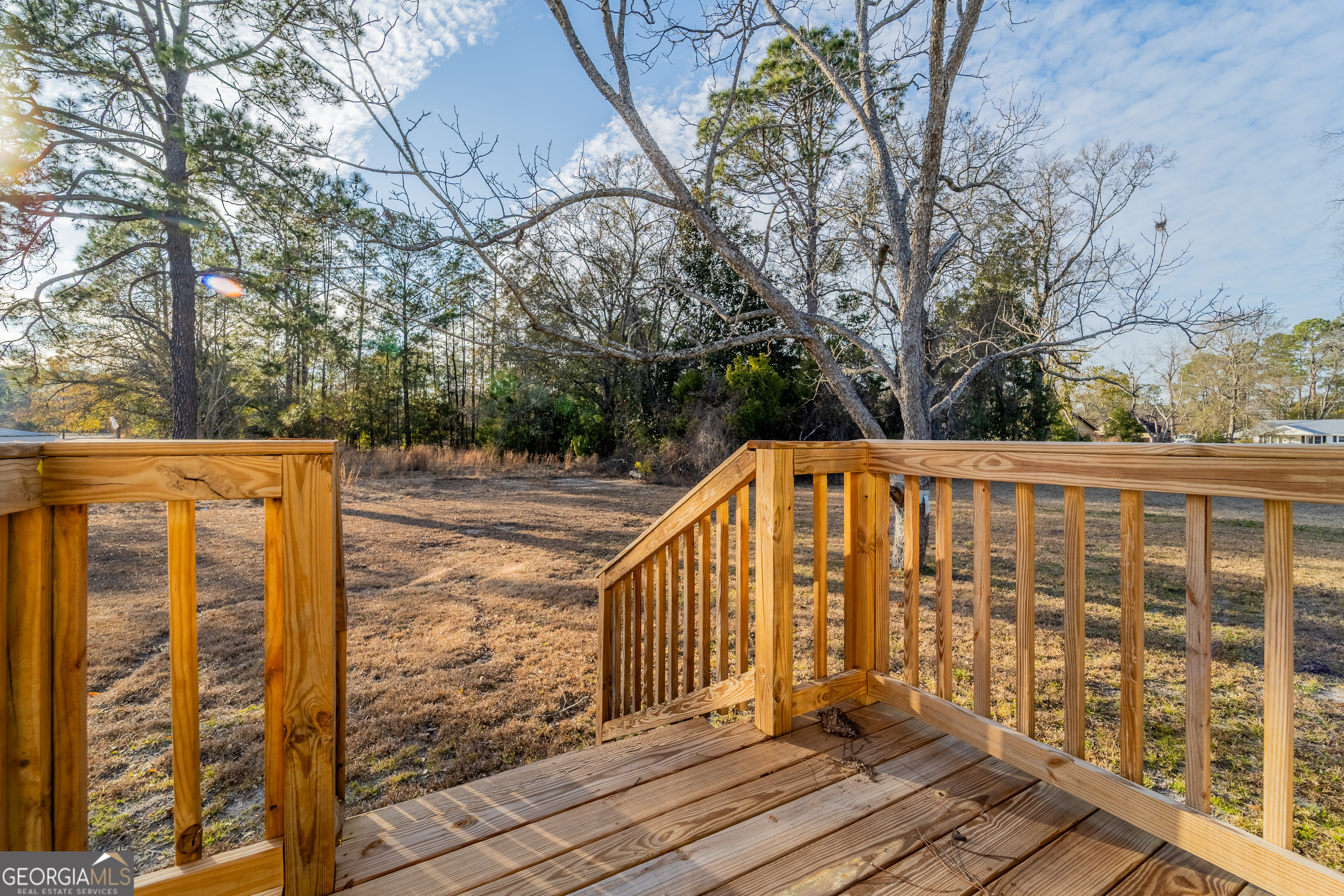 1808 Brunel Street Waycross, GA 31503 - Photo 24 of 26 a view of balcony with wooden floor and fence