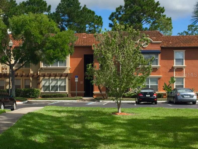 5104 Conroy Road, Unit 26 Orlando, FL 32811 - Photo 1 of 1 a building view with a garden space