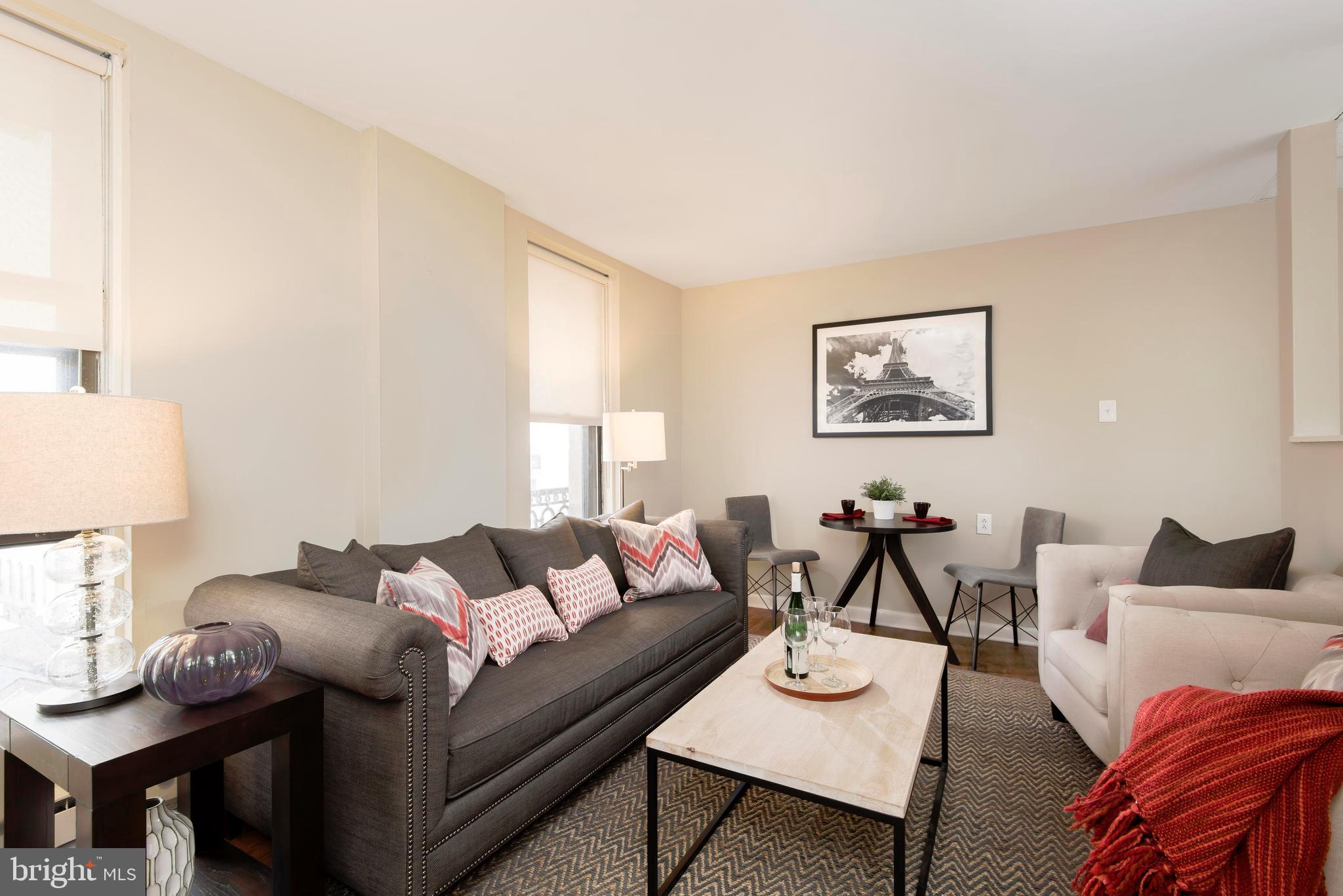 201 South 13th Street, Unit 608 Philadelphia, PA 19107 - Photo 4 of 23 a living room with furniture and a lamp