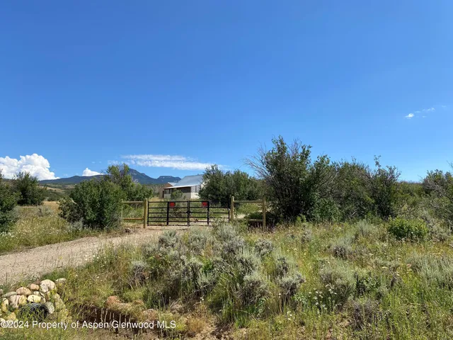 a view of a pathway both side of river next to a yard