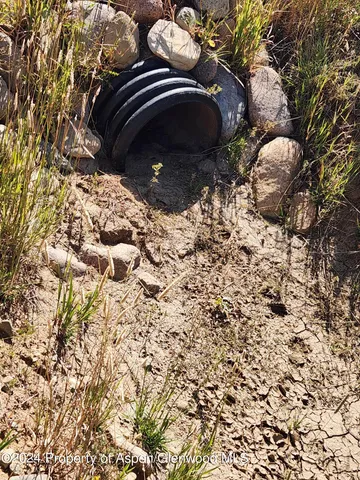 a view of a yard covered with snow