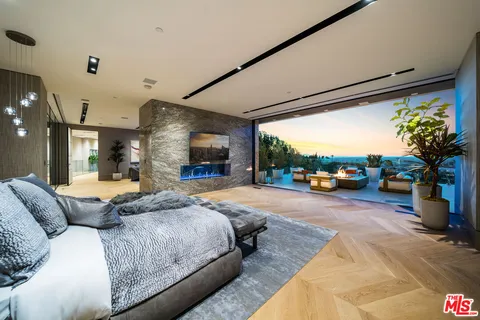 a living room with fireplace furniture and a flat screen tv