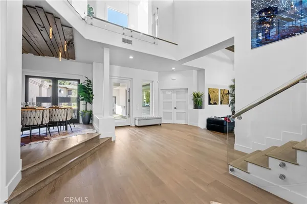 a large white kitchen with a large window