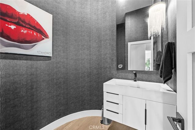 a large white kitchen with a large window