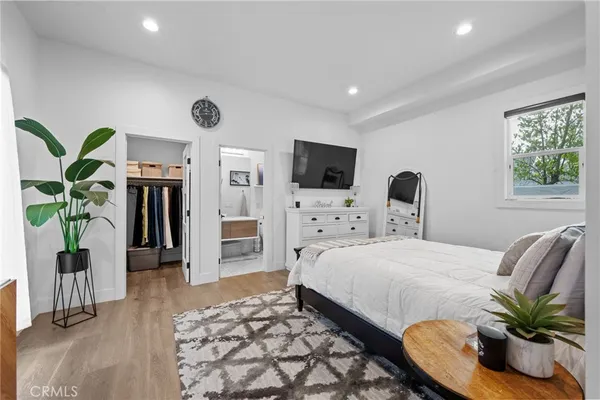 a kitchen with stainless steel appliances granite countertop a stove and a view of living room
