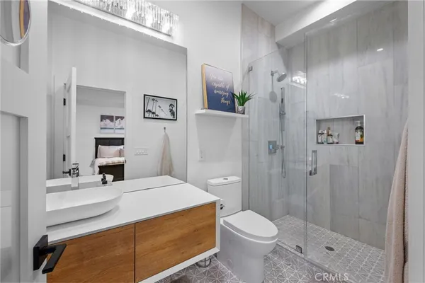 a kitchen with stainless steel appliances refrigerator and window