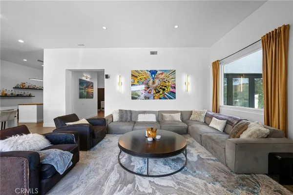 a view of a living room and wooden floor