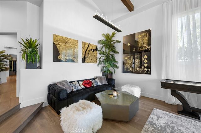 a view of a living room and wooden floor