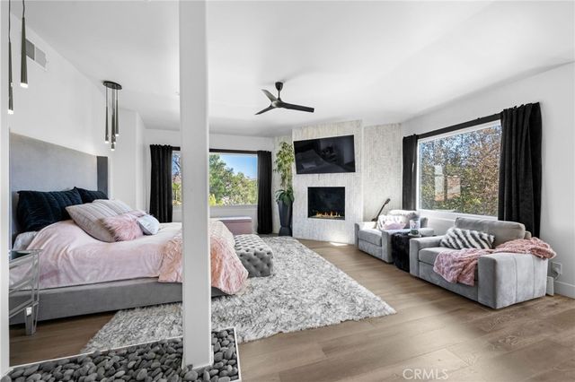 a kitchen with stainless steel appliances kitchen island granite countertop a refrigerator and a sink