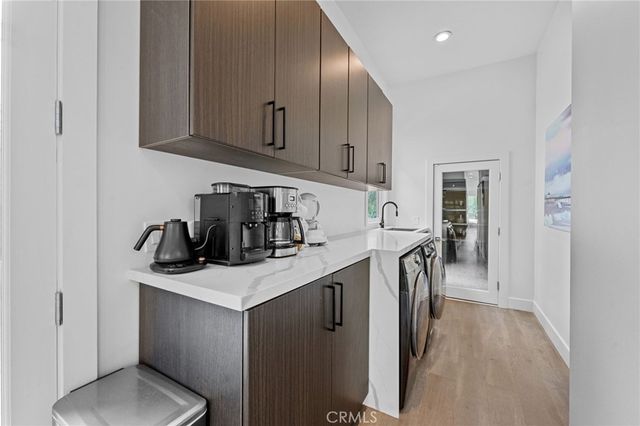 a view of a livingroom with furniture and a potted plant