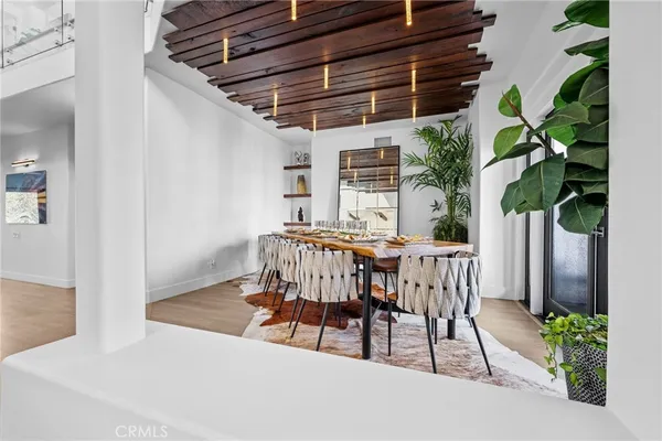 a bedroom with a bed and a flat screen television