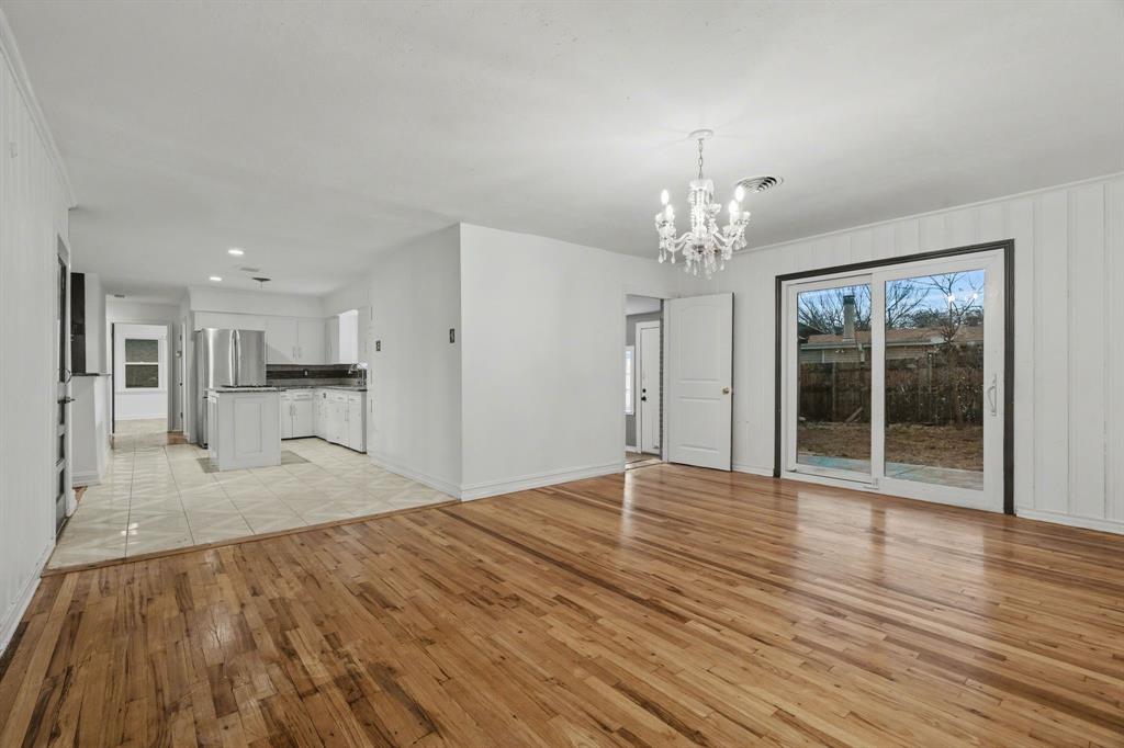 1714 East Union Bower Road Irving, TX 75061 - Photo 15 of 32 a view of livingroom with hardwood floor and kitchen