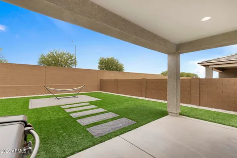 a view of a backyard with seating area