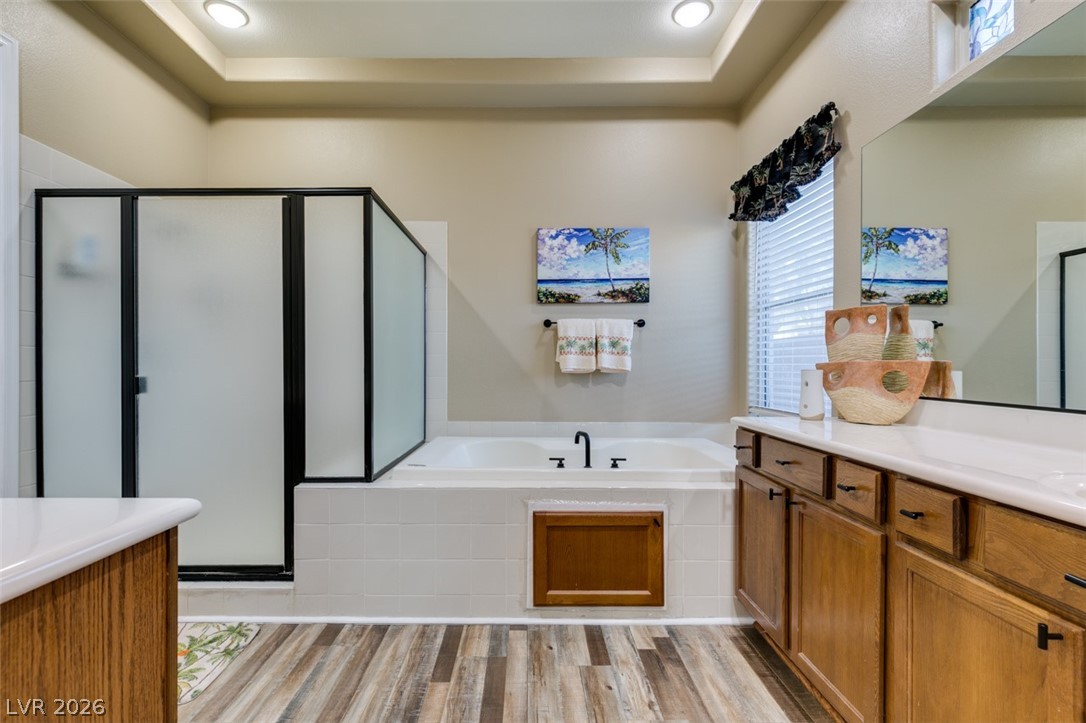 7524 Midnight Rambler Street Las Vegas, NV 89149 - Photo 40 of 51 Relax in this well-appointed bathroom featuring a deep soaking tub and an adjacent walk-in shower.