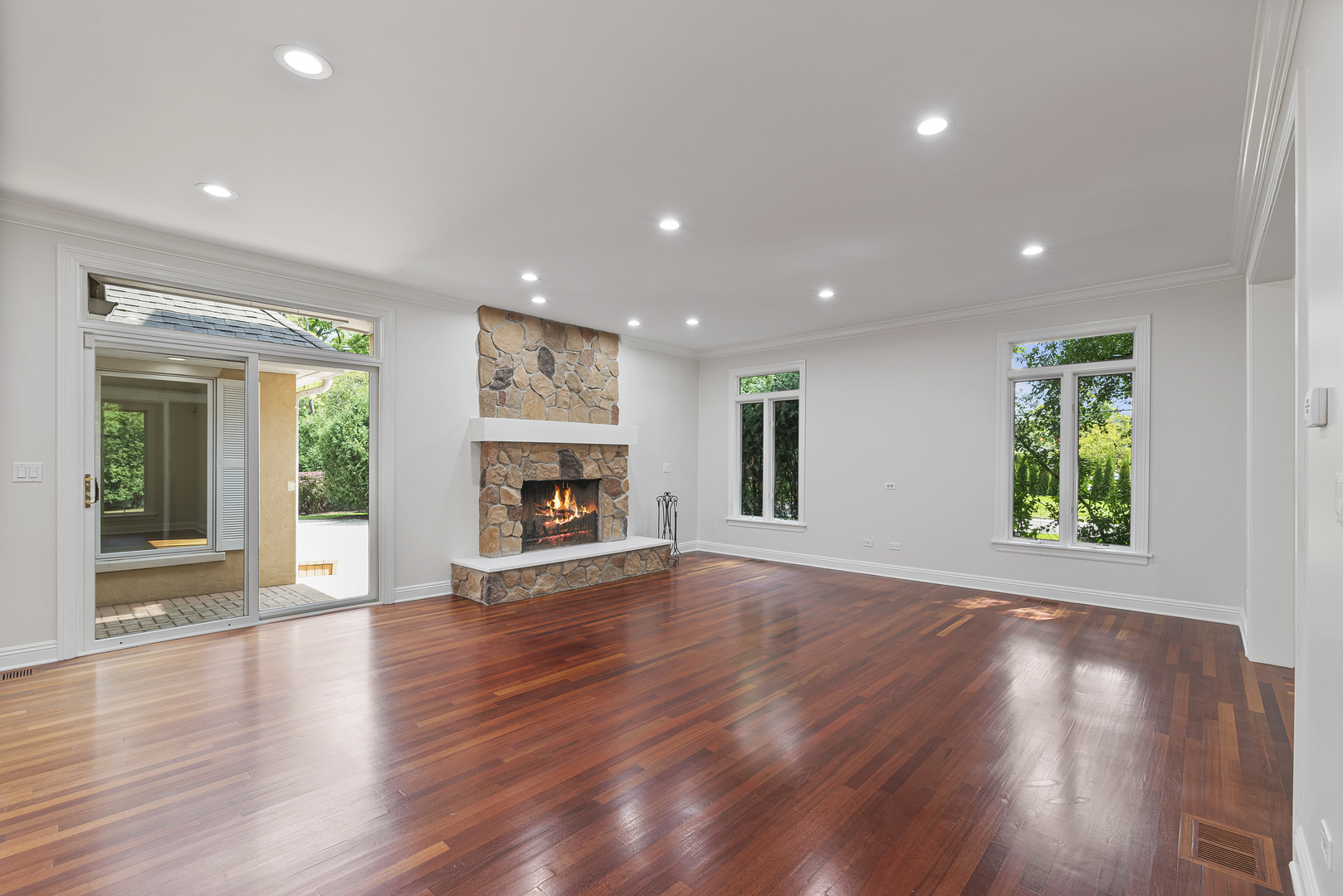 701 Ridge Road Highland Park, IL 60035 - Photo 12 of 60 an empty room with wooden floor and a window