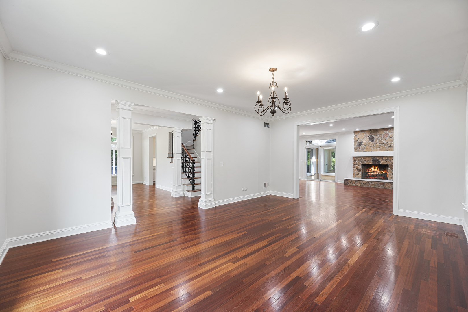 701 Ridge Road Highland Park, IL 60035 - Photo 17 of 60 a view of a livingroom with wooden floor and a kitchen