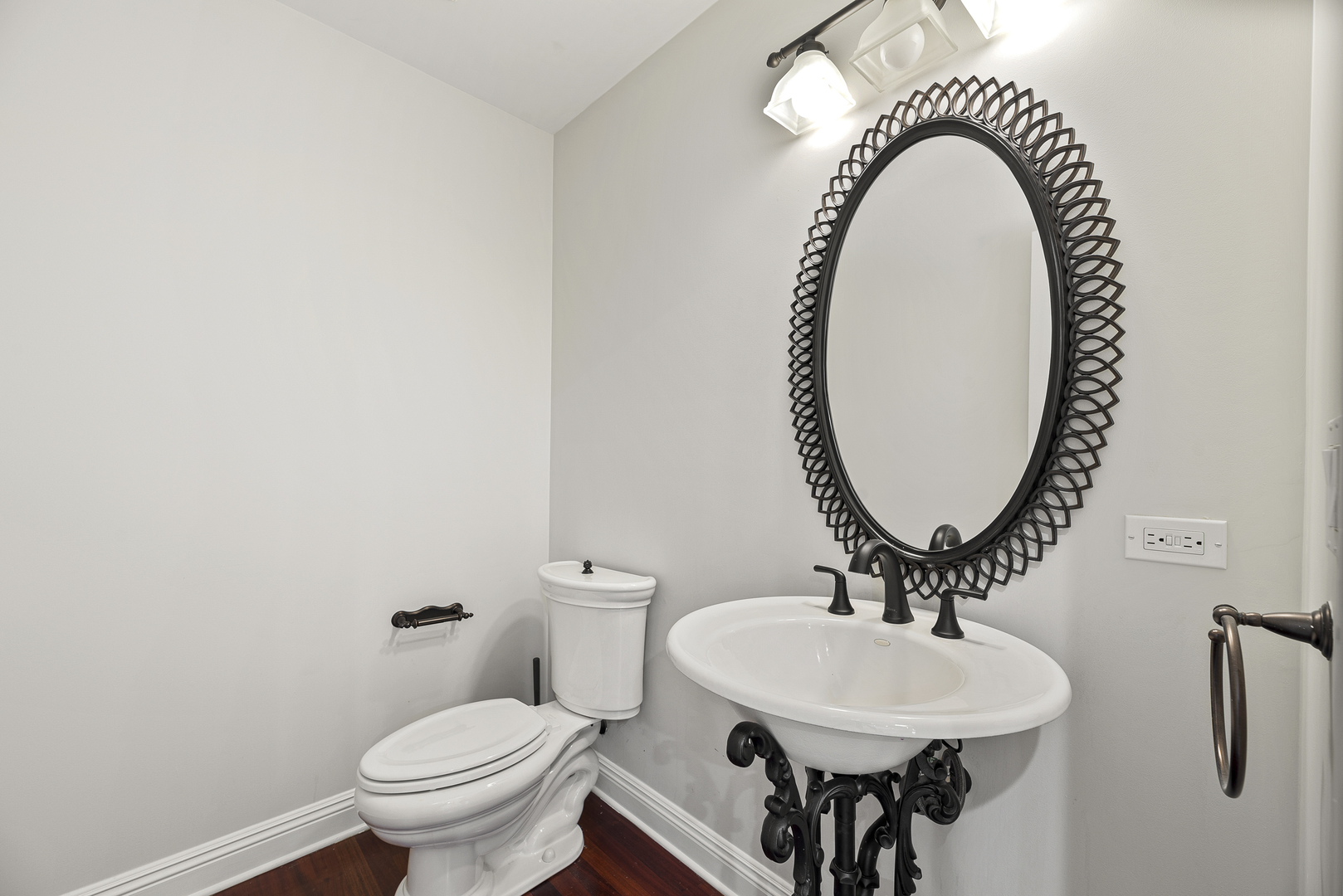 701 Ridge Road Highland Park, IL 60035 - Photo 18 of 60 a bathroom with a sink a mirror and a toilet