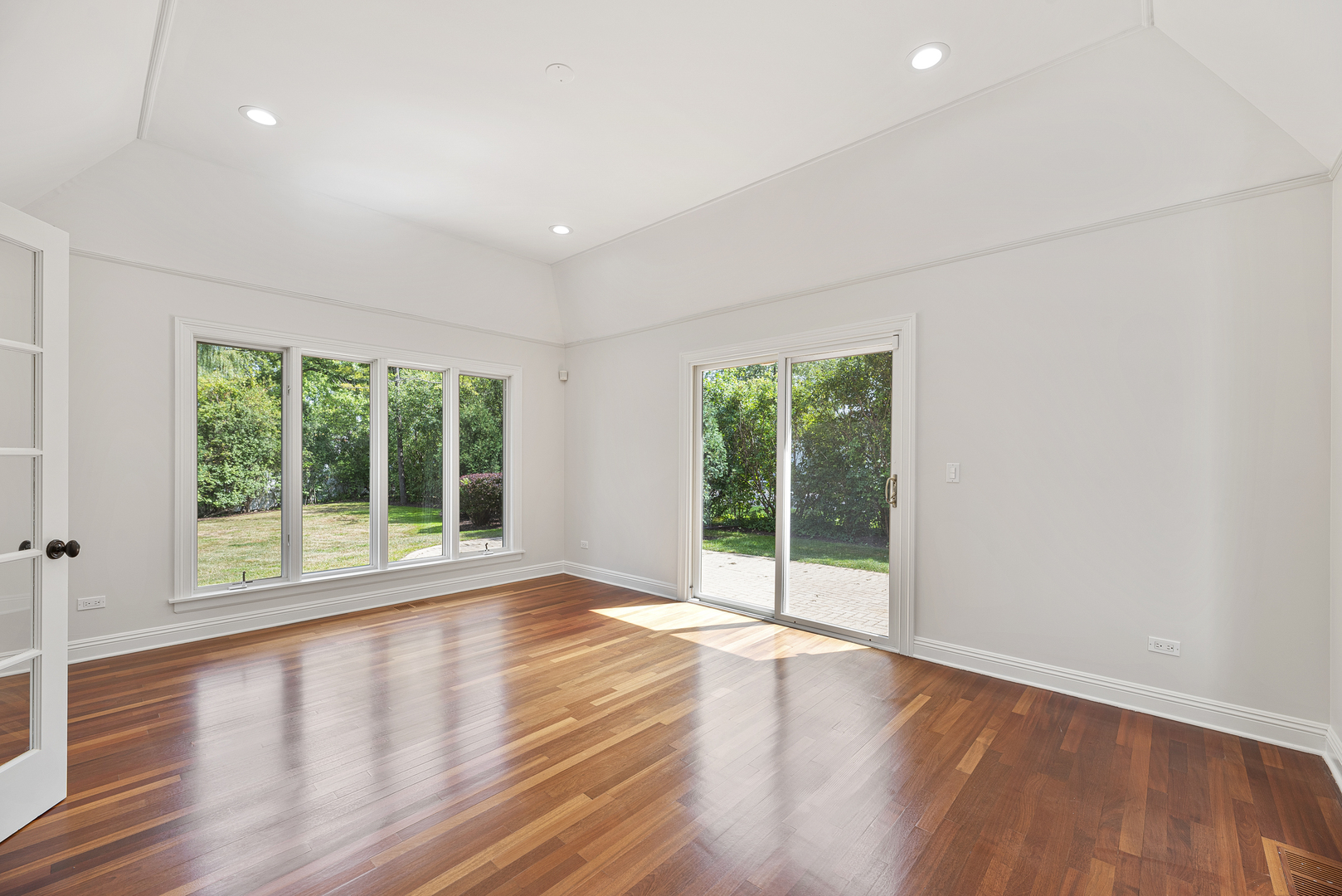 701 Ridge Road Highland Park, IL 60035 - Photo 19 of 60 a view of an empty room with wooden floor and a window