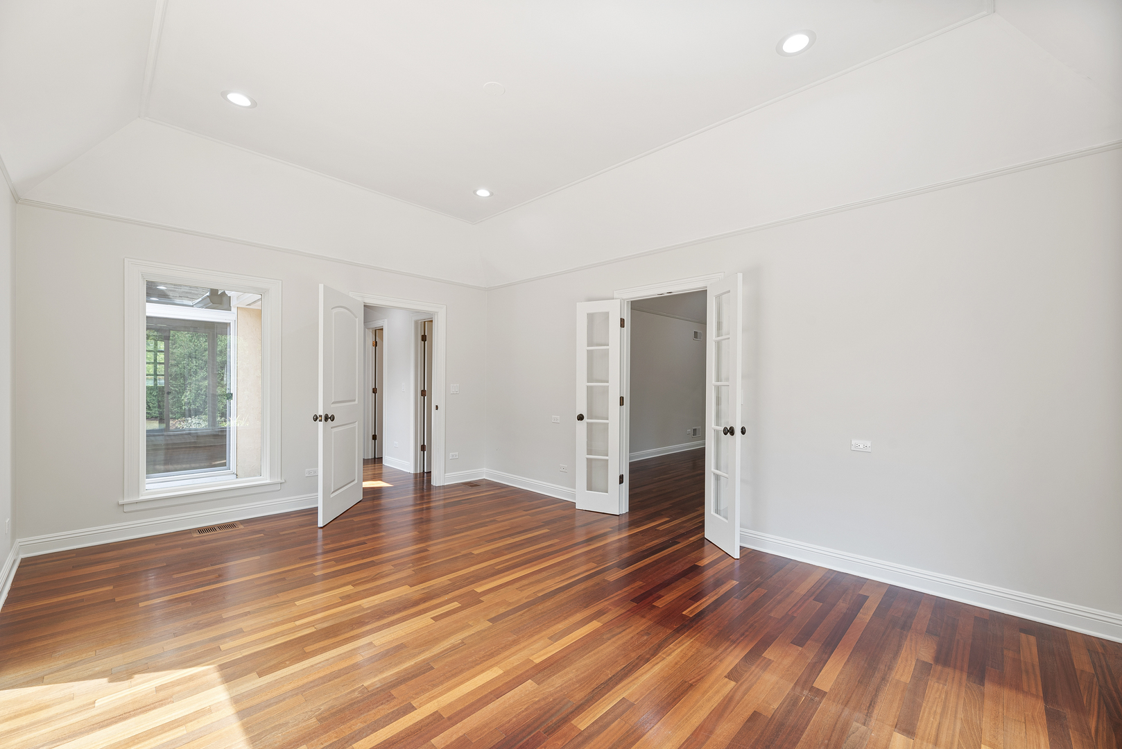 701 Ridge Road Highland Park, IL 60035 - Photo 20 of 60 a view of an empty room with wooden floor and a window