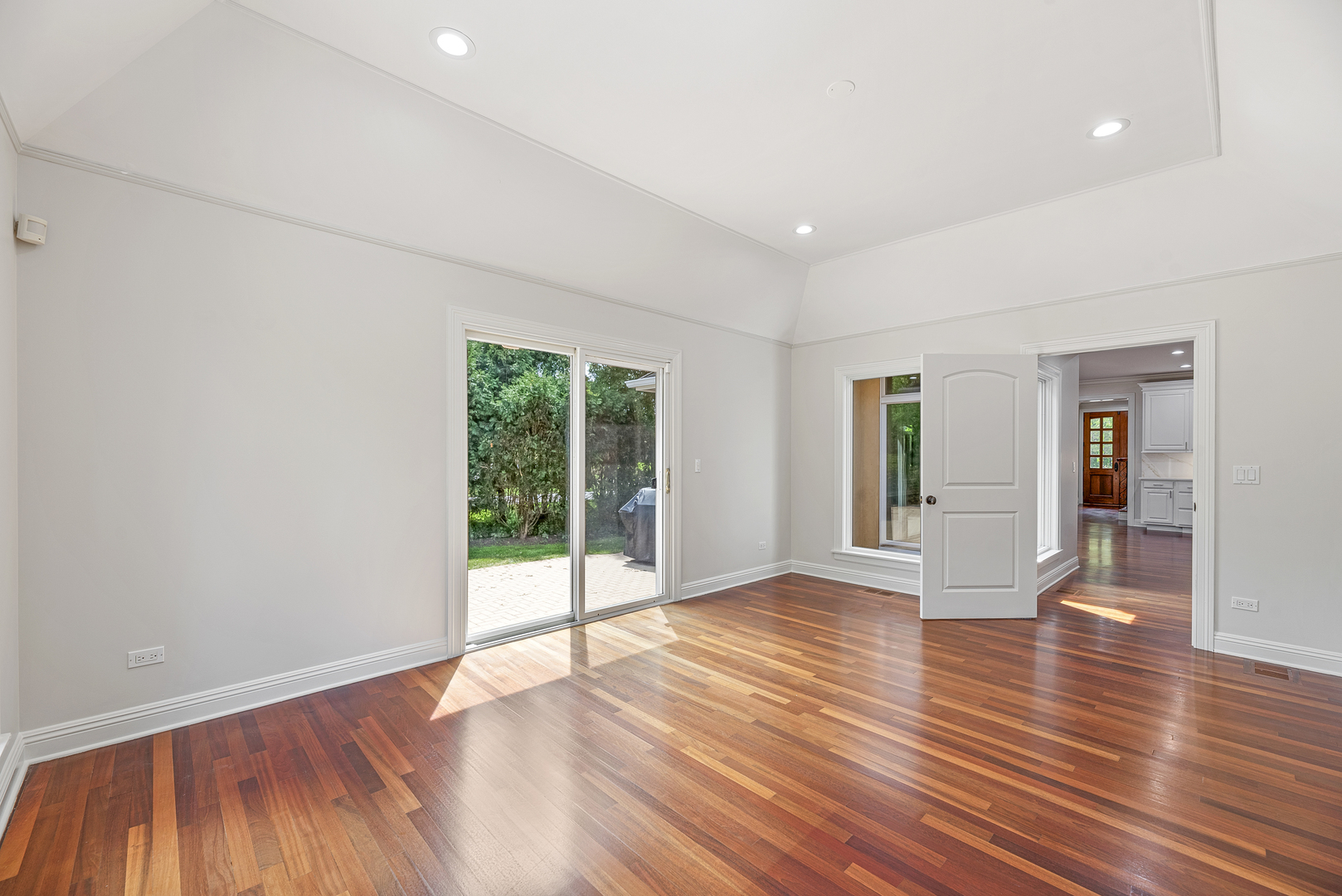 701 Ridge Road Highland Park, IL 60035 - Photo 21 of 60 a view of an empty room with wooden floor and a window