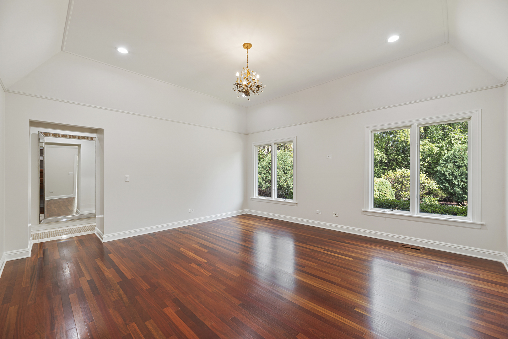 701 Ridge Road Highland Park, IL 60035 - Photo 22 of 60 a view of an empty room with wooden floor and a window