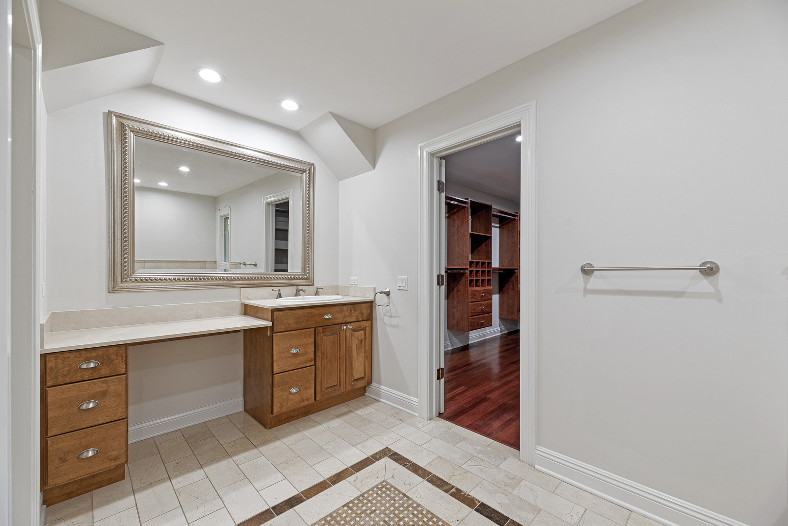 701 Ridge Road Highland Park, IL 60035 - Photo 23 of 60 a spacious bathroom with a double vanity sink and a mirror