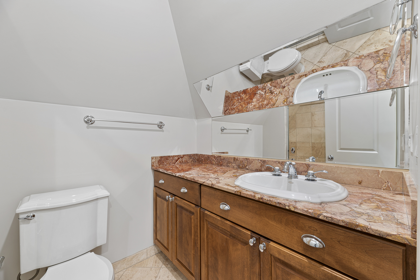 701 Ridge Road Highland Park, IL 60035 - Photo 31 of 60 a bathroom with a granite countertop sink a toilet and a mirror