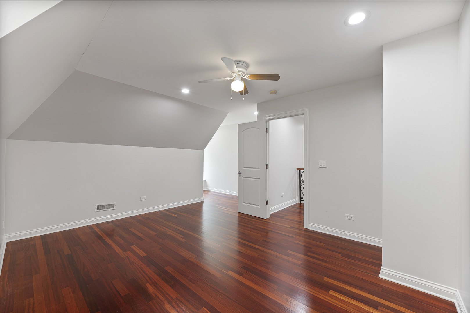 701 Ridge Road Highland Park, IL 60035 - Photo 32 of 60 an empty room with wooden floor and ceiling fan