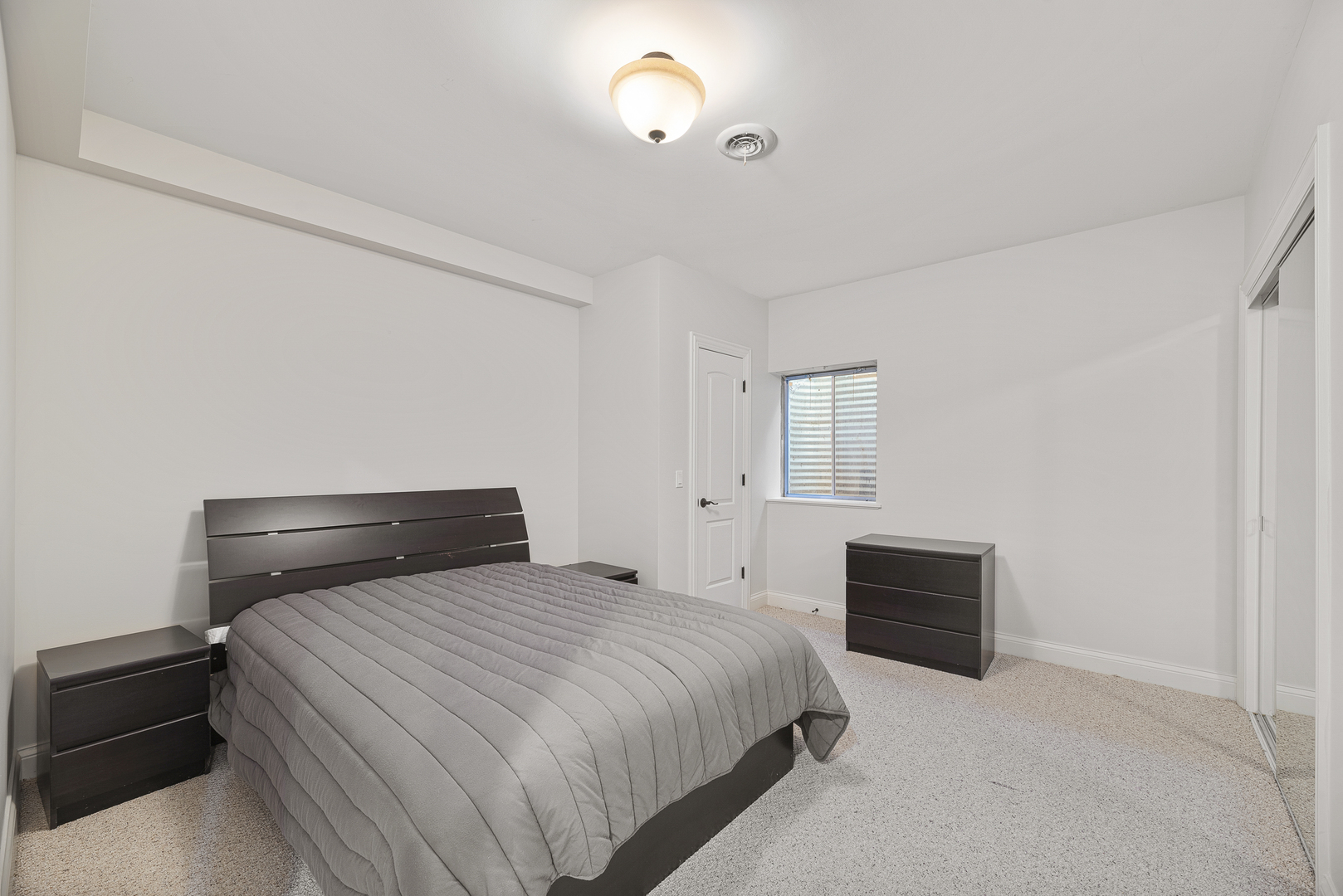 701 Ridge Road Highland Park, IL 60035 - Photo 38 of 60 a bedroom with a bed and a night stand