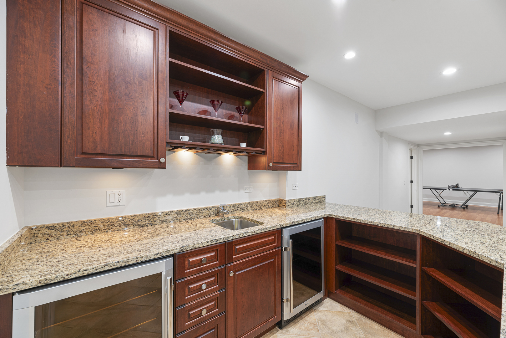 701 Ridge Road Highland Park, IL 60035 - Photo 43 of 60 a kitchen with granite countertop stainless steel appliances a sink and cabinets
